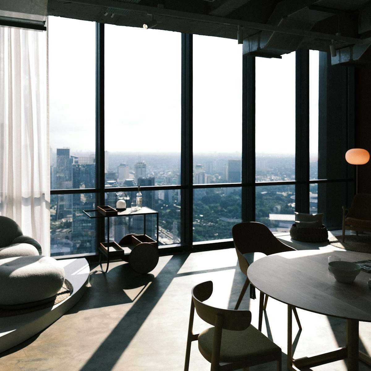 A quiet lounge high above the city, with floor-to-ceiling windows